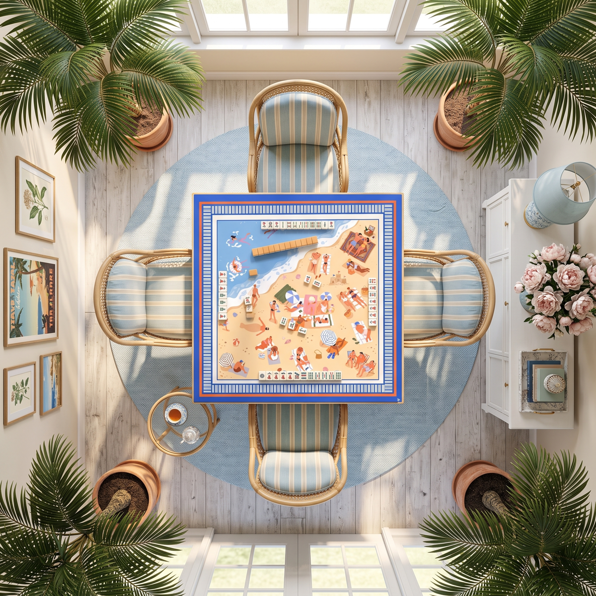 Summer Map American Mahjong mat on a round table with tiles and blue-striped rattan chairs