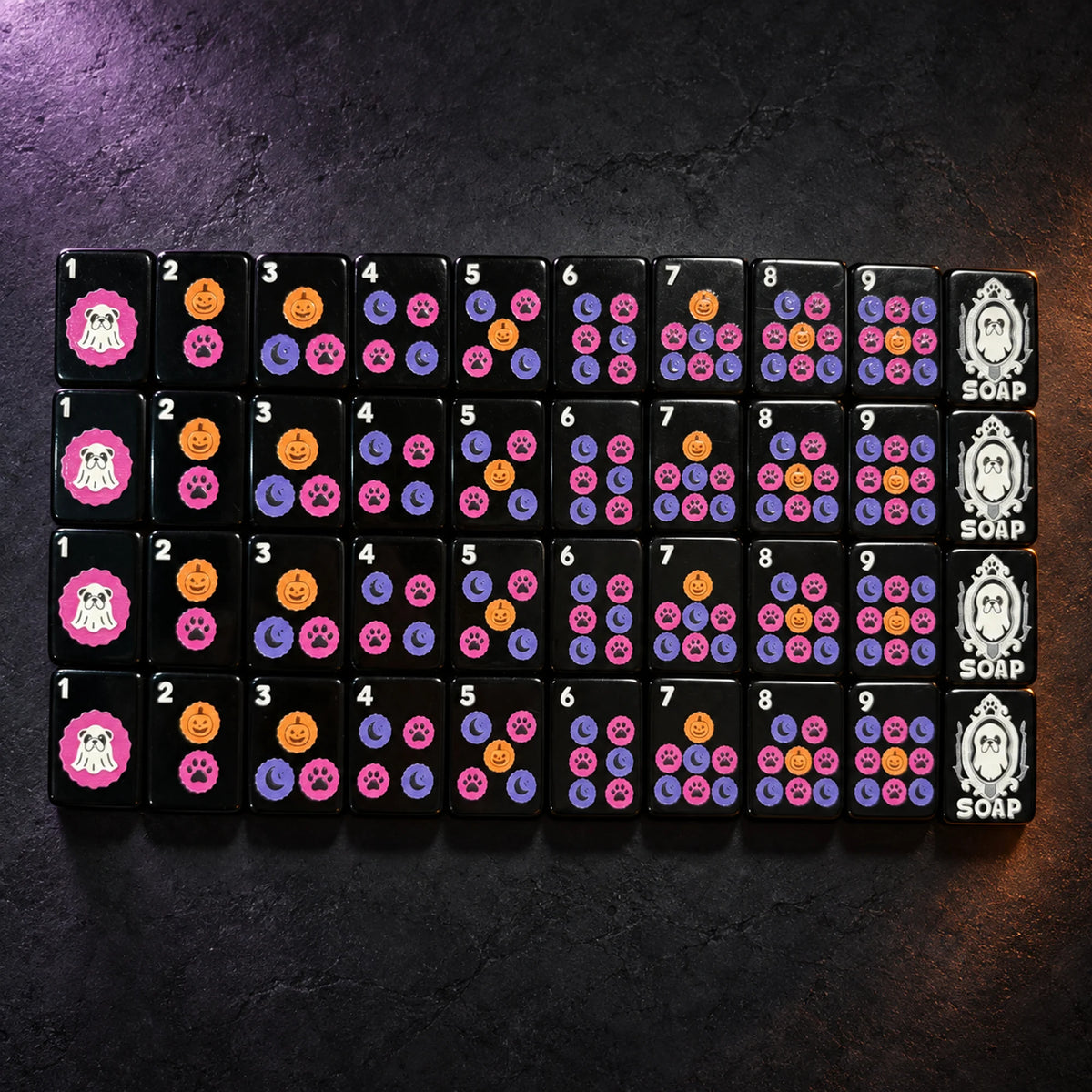 Black dot suit Mahjong tiles with pumpkins, paw prints, crescent moons, and a bulldog Soap tile