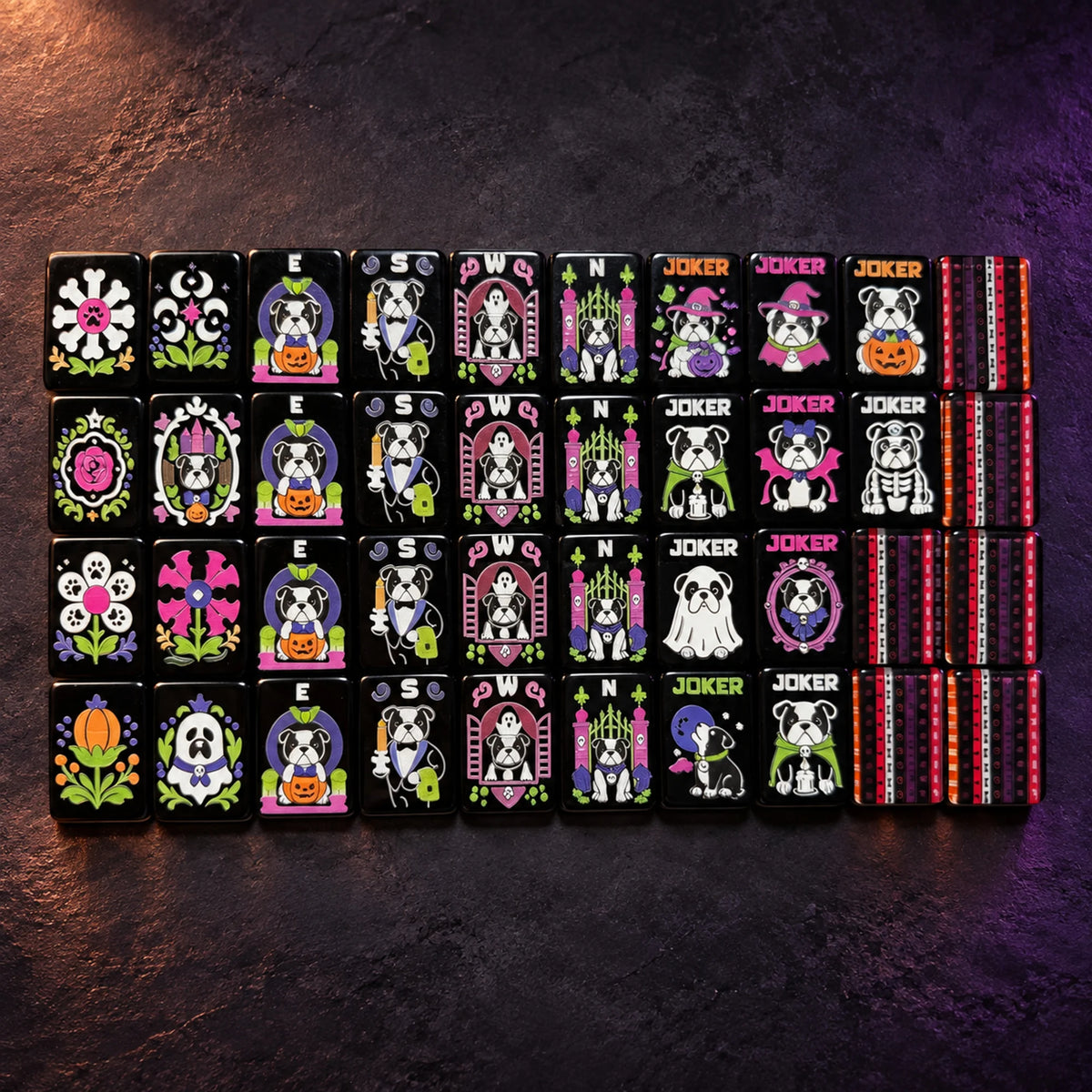 Halloween bulldog flowers, winds, jokers, and striped tile backs arranged on a dark background