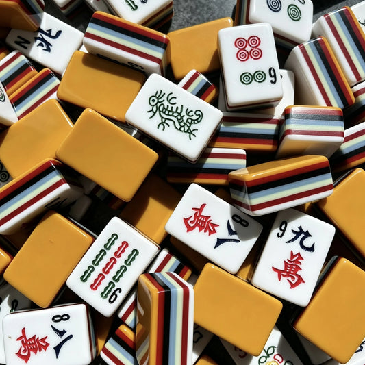 Layered Ember American Mahjong tiles with orange backs and layered edges